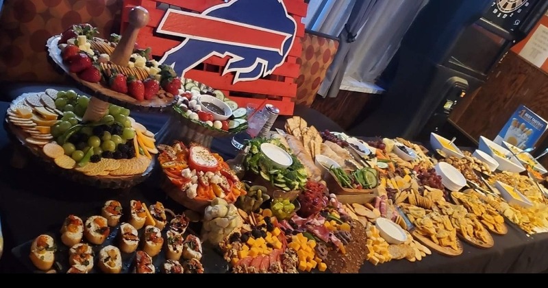 Various cheeses and vegetables on tray