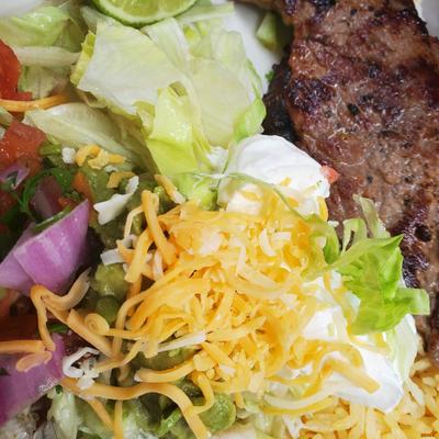Meat dish served with salad