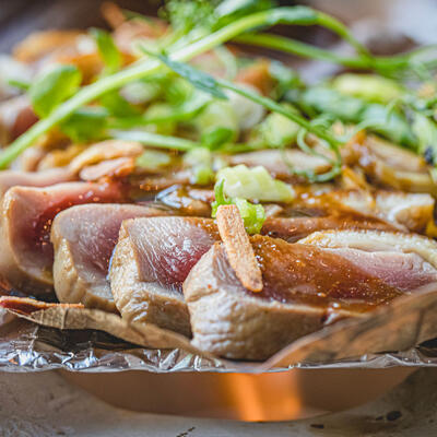 Grilled meat, green vegetables and decorations, closeup