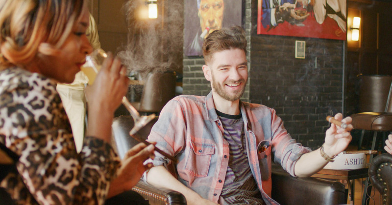A man smokes a cigarette