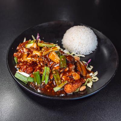 Almond Boneless Chicken, served with steamed white rice.