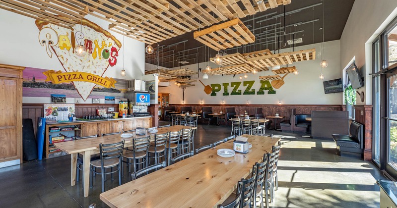 Interior, long tables and seats, wall decoration