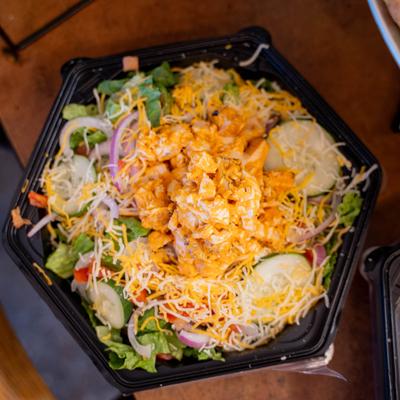 Buffalo Chicken Salad with fresh vegetables, jack and cheddar cheese.