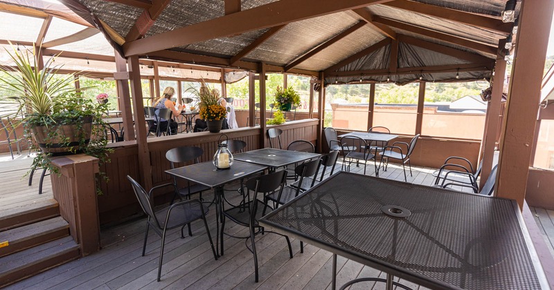 Covered patio, tall table on the right