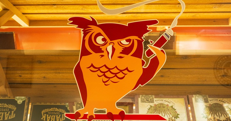 Window graphics on a display case, a smoking owl