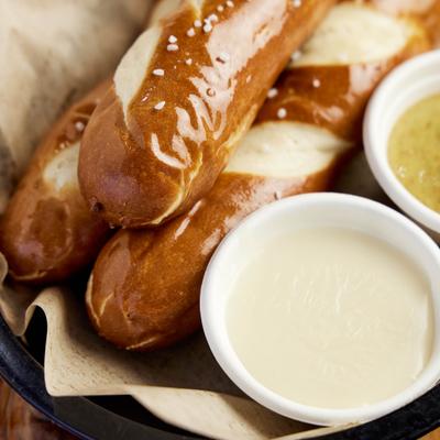 Grilled pretzel sticks served with honey mustard and house beer cheese sauces.