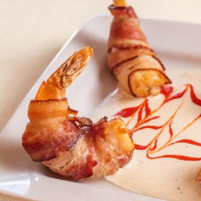 Deep-fried bacon wrapped shrimp stuffed with horseradish