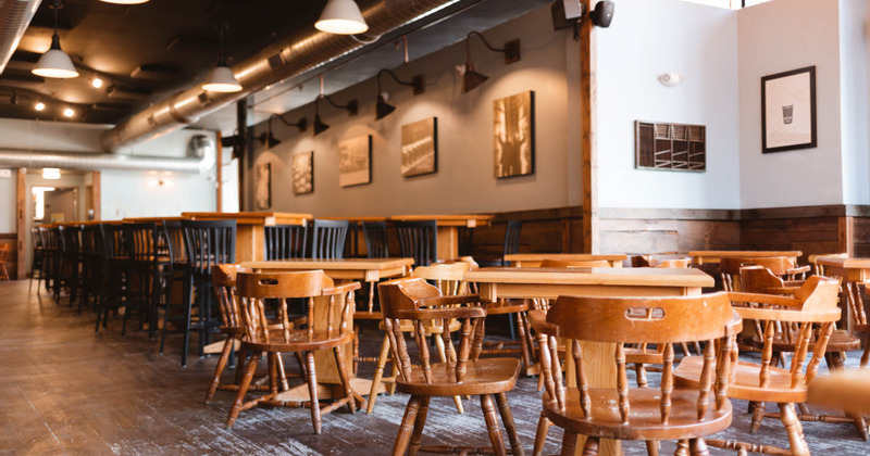 Interior, dining tables ready for guests