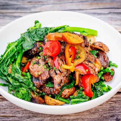 Steak Tips served with vegetables.
