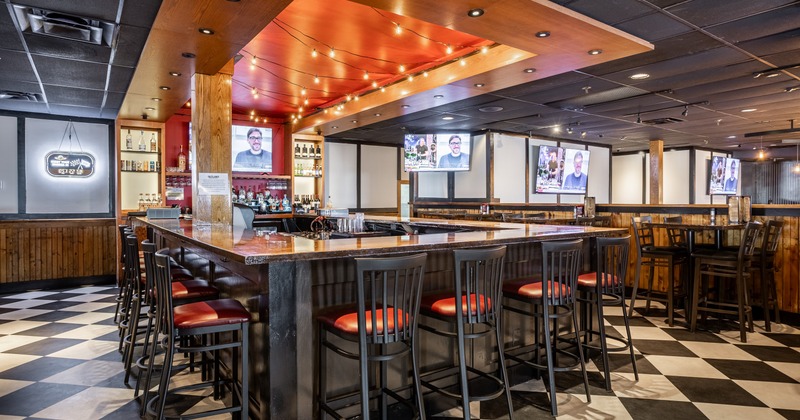 Interior, bar area with black and white tile floor