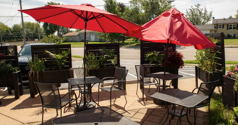 Exterior, tables with parasols and chairs