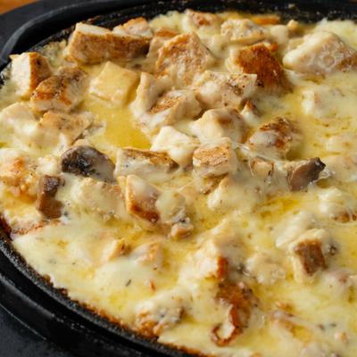 Mexican melted cheese with chicken and mushrooms.