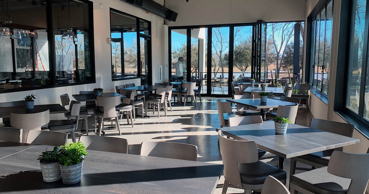 Interior, tables and chairs waiting for guests