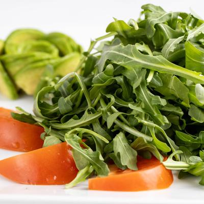 Arugula salad with tomatoes.