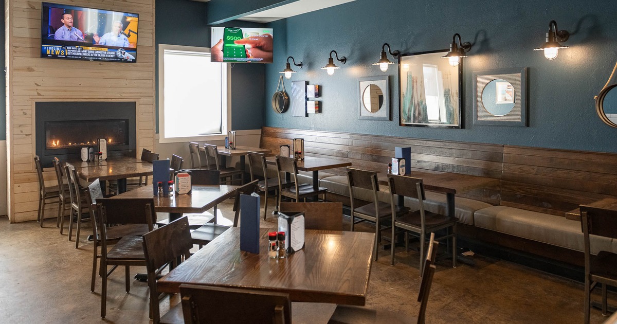 Interior, bench seating space, tables and chairs