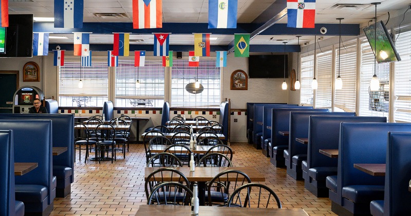 Restaurant interior, dining area, tables, chairs and booths