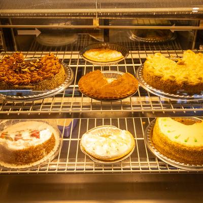 Various pies in the glass case.