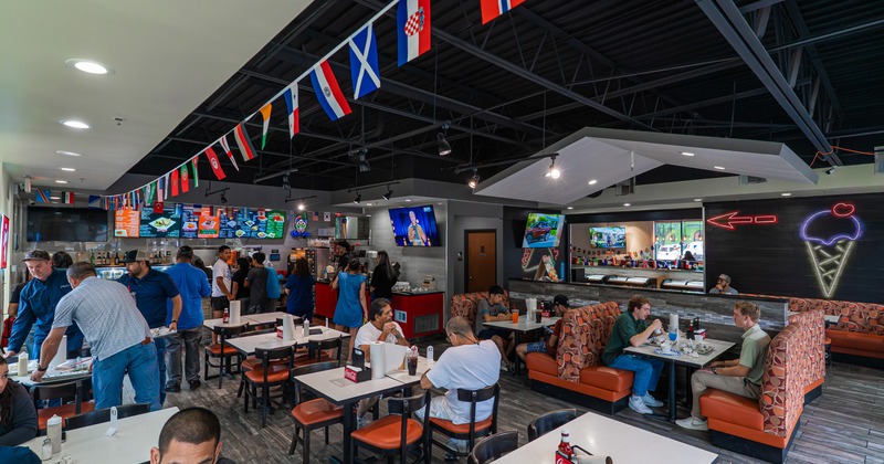 Interior, dining area with small flags hanging from the ceiling