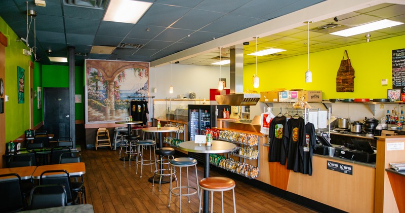 Interior, seating area with merch on sale