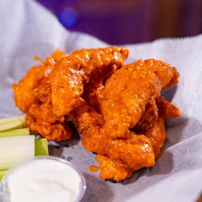 Buffalo Wings with blue cheese dip and celery.