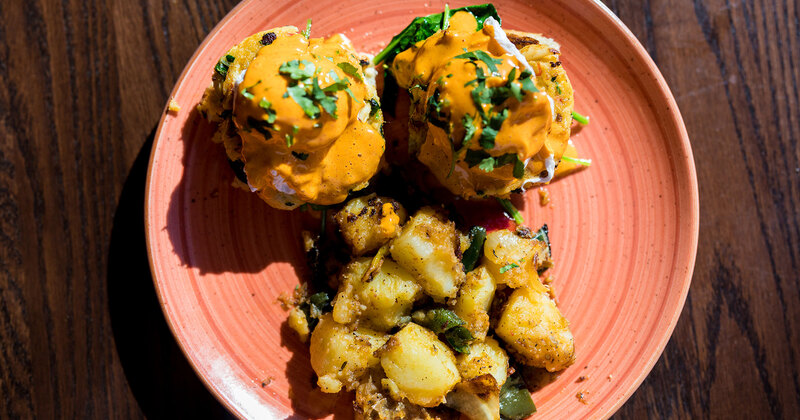 Crab Cake Benedict served with sweet potatoes