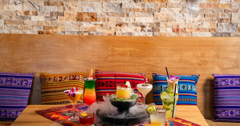 Decorated booth with assorted drink on table in front