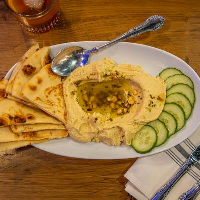 Hummus and pita bread with cucumber.