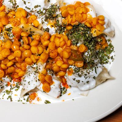 Ground chicken dumplings,  topped with a yogurt-based sauce and lentils.