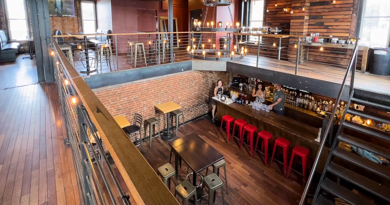 Interior with dining booths and seating area bellow