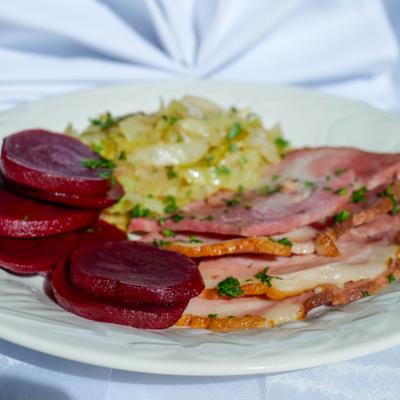 Black oak ham with sides, close view.
