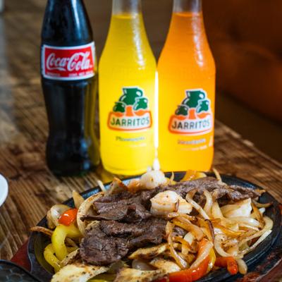 Mixed meat Fajitas and sodas.