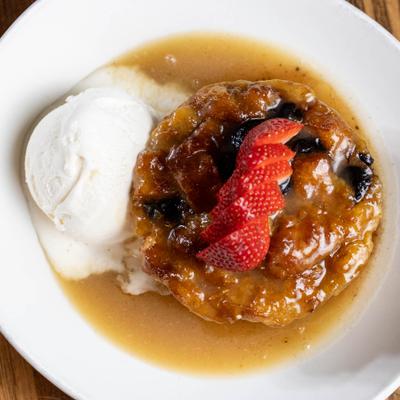Croissant Bread Pudding served with ice cream.