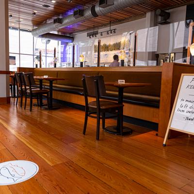 Restaurant interior, tables lined up, ready for guests