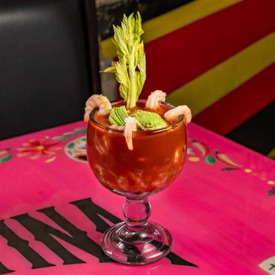 Shrimp cocktail served on the table.