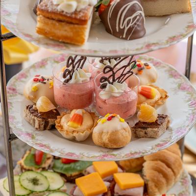 Afternoon tea tray with assorted desserts.