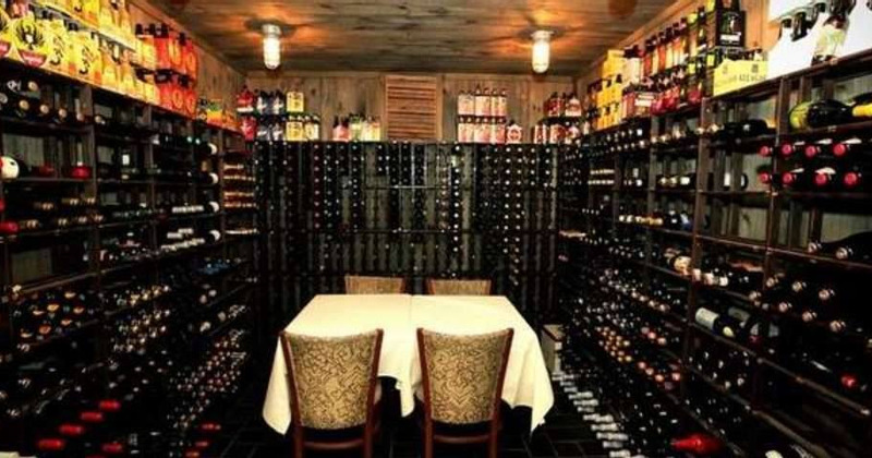 Interior, shelves with bottles of wine