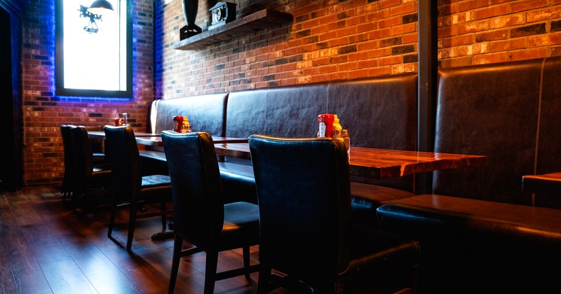 Diner area, booths by the brick wall