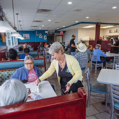Interior, guests in dining area.