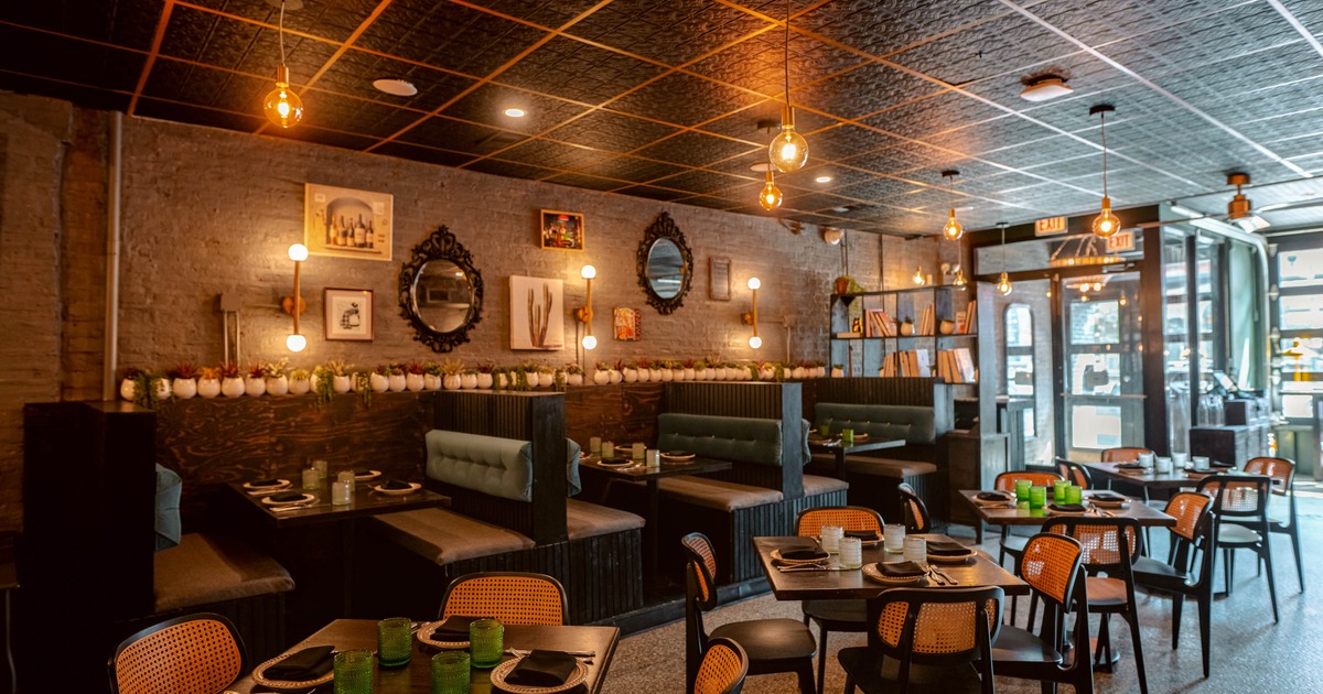 Interior seating area with chairs, tables and double booths