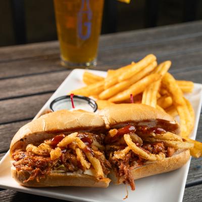 BBQ pork sandwich with side fries.