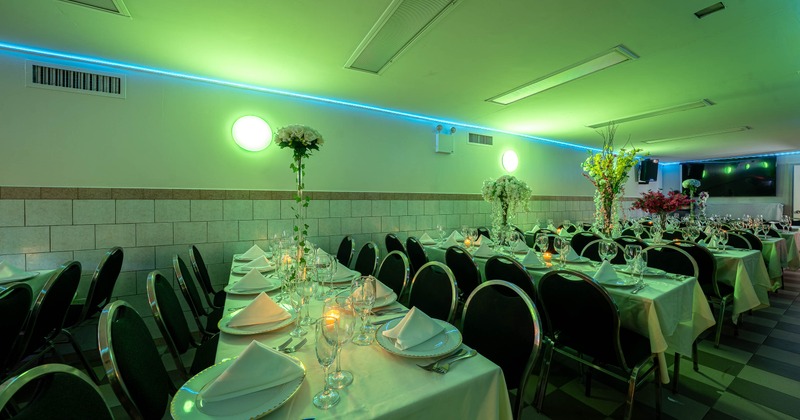 Interior, tables set for guests