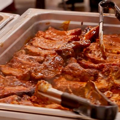 Pork ribs in a buffet-style tray.