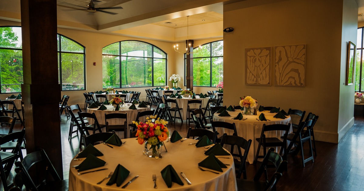 Interior, dining space with round tables and art of the walls