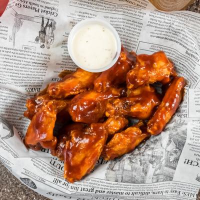 BBQ chicken wings and ranch dressing.