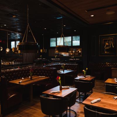 Interior, seating area with tables ready for guests