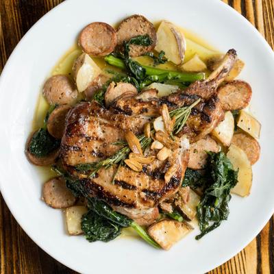 Grilled pork chop, with potatoes and veggies.