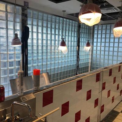 A red and white checkered wall in a restaurant is built