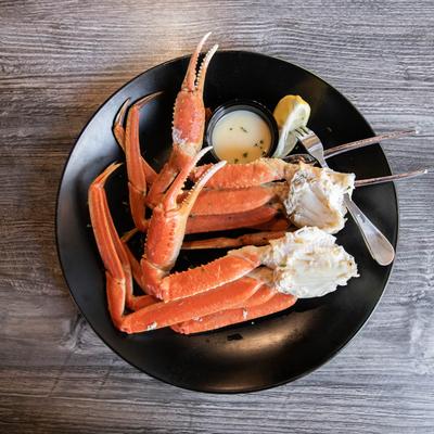 One pond steamed Alaskan snow crab legs with lemon butter sauce and lemon