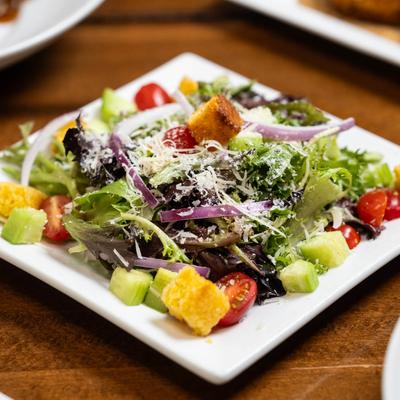 Mixed greens, grape tomatoes, cucumber, red onion, parmesan cheese, and cornbread croutons.