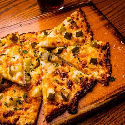 Pickle Pizza Flatbread, with cheese.